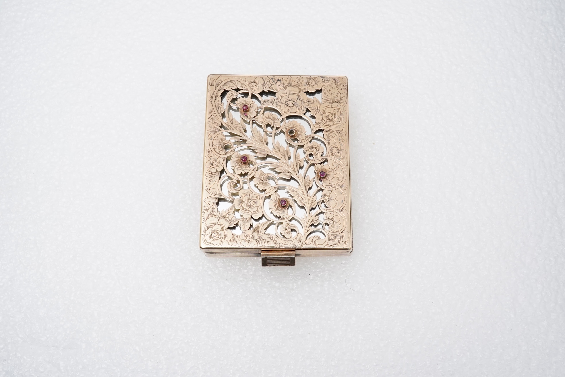 Boucheron, a silver gilt and ruby vanity case, France, 1940s